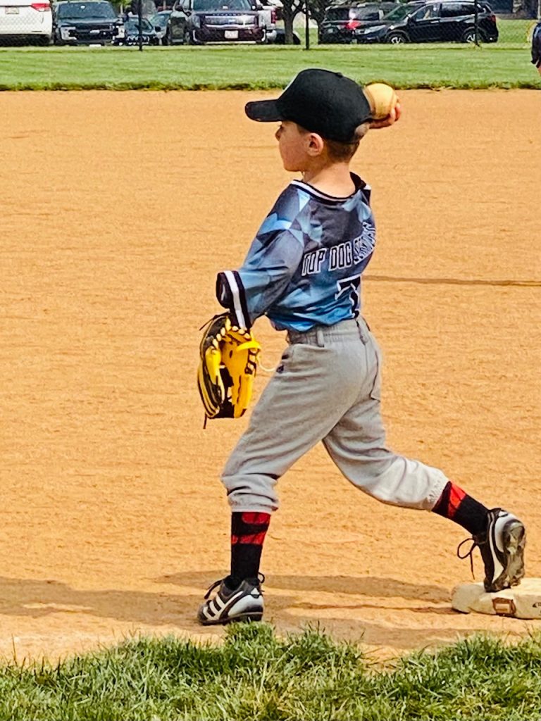 little boy playing baseball